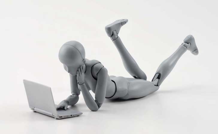 Anatomy Tools Review female figure lying on floor with laptop